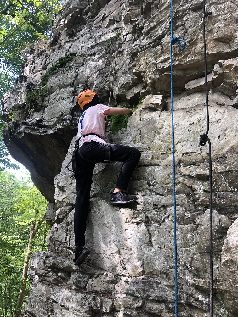 Former LIFE student rock climbing